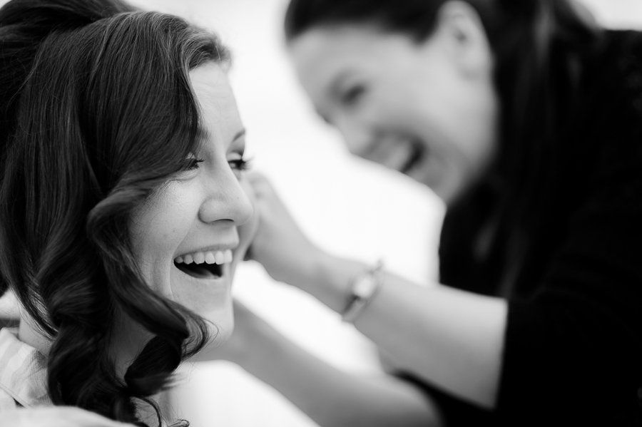 hair stylist working on bridal hair become a wedding hair stylist