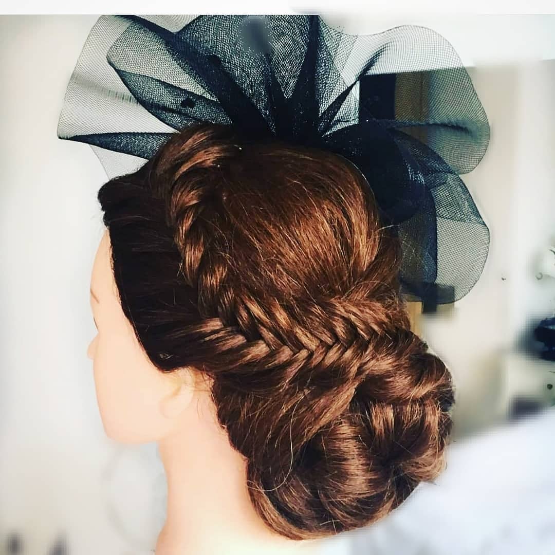 student getting hands on for hair up course