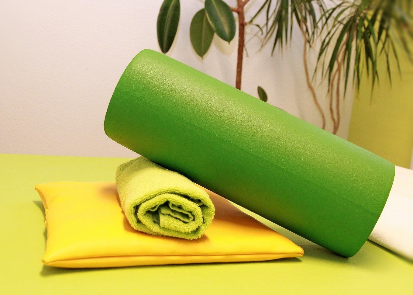 Fitnessrolle und Handtuch für Ihre Behandlung.