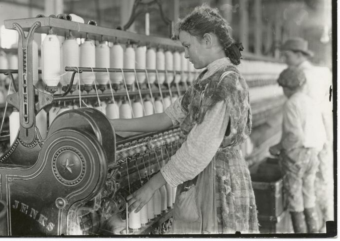 Young girl working in a mill, early 20th century