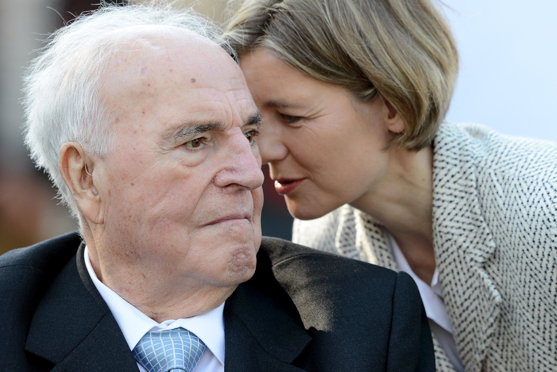 Maike Kohl-Richter whispers in her husband's ear, former Chancellor Helmut Kohl (CDU), on 21 May 2013 at the German-German Museum in the once divided village of Mödlareuth near Hof (Bavaria) during the ceremonial unveiling of a commemorative plaque. The Bavarian state government honoured former Chancellor Kohl for his services to German unity. Photo: David Ebener/dpa