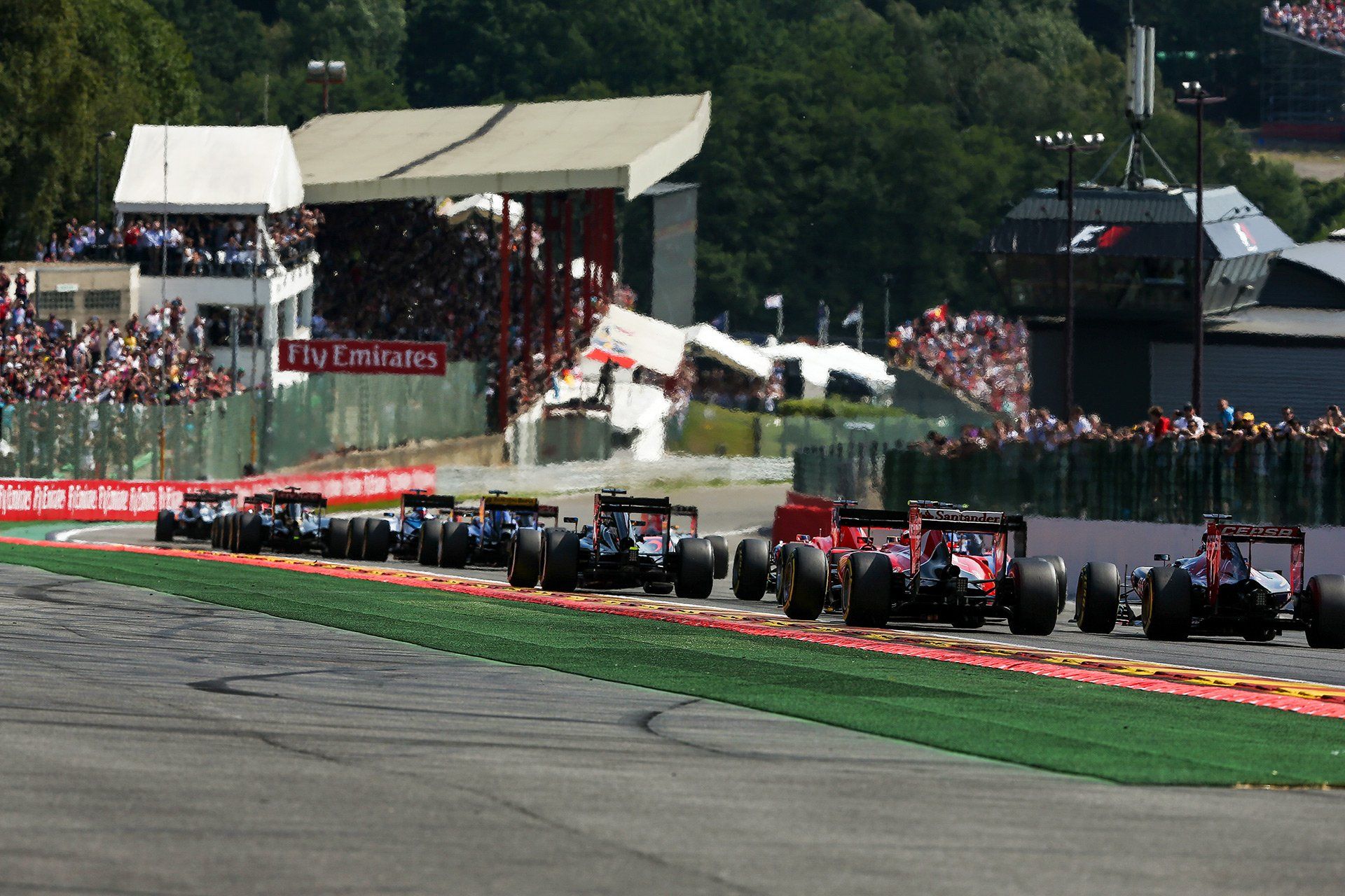 British Formula One driver Lewis Hamilton of Mercedes AMG leads the pack after the start of the Formula One Grand Prix of Belgium at the Circuit de Spa-Francorchamps near Spa, Belgium, 23 August 2015. Photo: David Ebener/fototronik.de