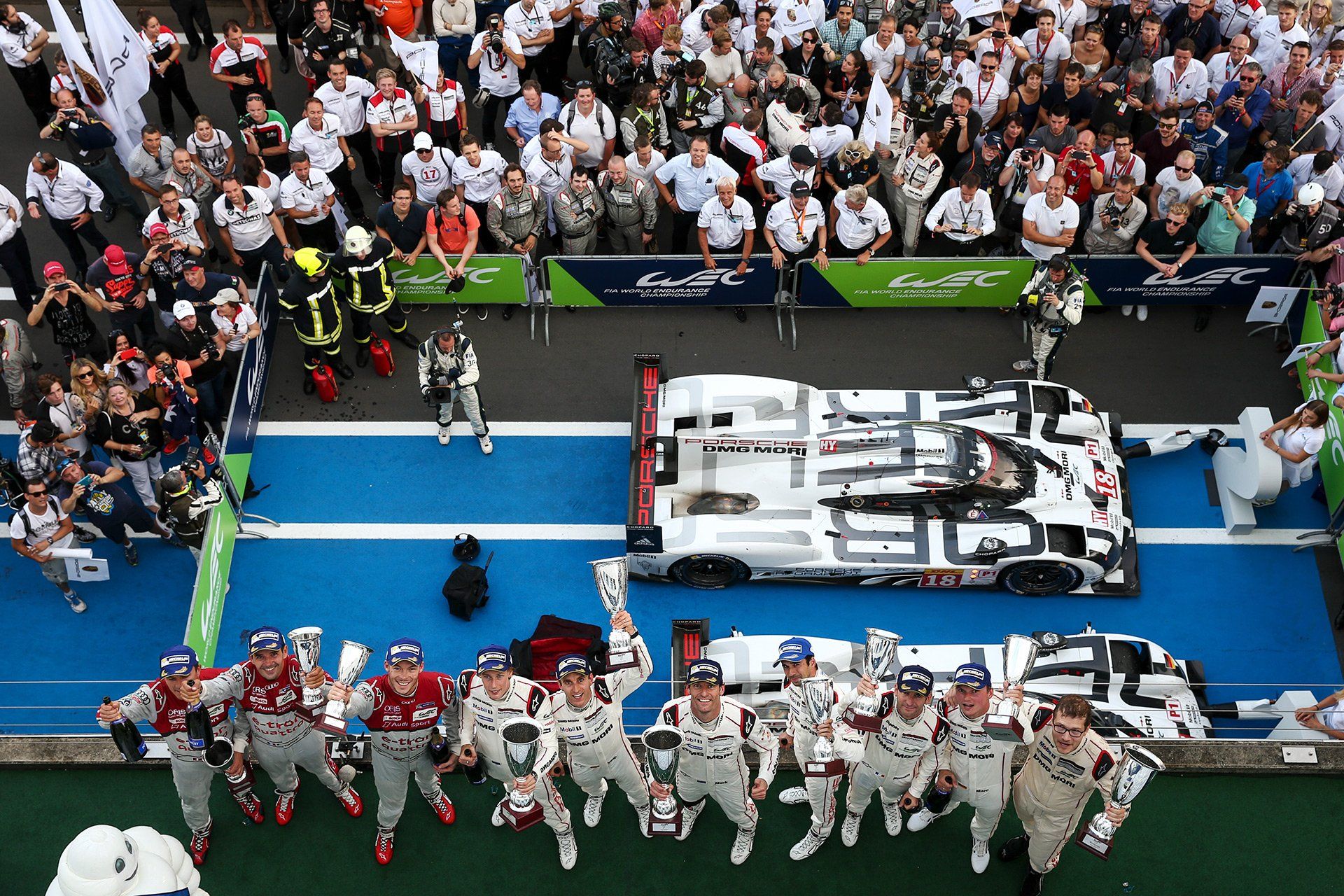 LMP1 Podium: Winning LMP1 919 Hybrid of Porsche (driver line-up: Australian Mark Webber / German Timo Bernhard / New Zealander Brendon Hartley), 2nd LMP1 919 Hybrid (18) of Porsche (driver line-up: German Marc Lieb / Swiss Neel Jani / French Romain Dumas) and 3rd LMP1 R18 e-tron quattro (7) of Audi Sport (driver line-up: Swiss Marcel F?ssler / German Andre Lotterer / French Benoit Treluyer) on the podium after the FIA World Endurance Championship (WEC) 6 hours race at the Nuerburgring, Germany, 30 August 2015. Photo: David Ebener/fototronik.de *** Stichworte *** WEC, World Endurance Championship, Motorsport, Sport, Nuerburg, Nuerburgring, race, track, sechs 6 Stunden vom Nürburgring, six 6 Hours of Nürburgring, 6h, Federation Internationale de l'Automobile, LeMans, Le Mans, LMS, LMES, Prototypen, Rennwagen, Prototypes, Endurance, Rheinland-Pfalz