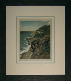 Photo of the Cabot Trail framed in a brown rustic frame with cream and light teal mats