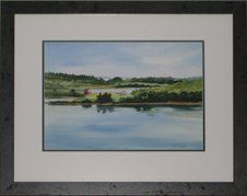 Watercolour of shoreline framed in a charcoal distressed frame with white and blue mats