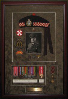 Portrait, medals, Glengarry cap, badges, pins framed in a mahogany shadow box with khaki suede mats
