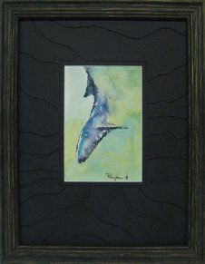 Watercolour of a whale diving framed in a blue rustic frame with dark blue mat hand-cut into waves
