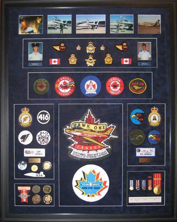 A military shadow box with medals, badges, photos, cap badges, pins belonging to a member of the Royal Canadian Air Force