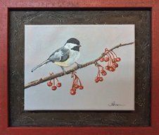 Painting of a chickadee with red berries framed in a red and brown distressed float frame