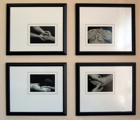 Set of 4 black & white photos for massage therapy framed in black frames with white and black mats