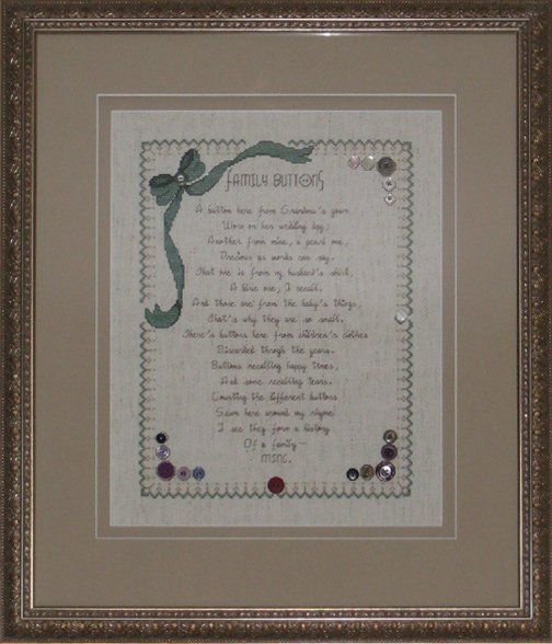 A cross-stitch with a family button verse framed with an antique gold frame and taupe mat