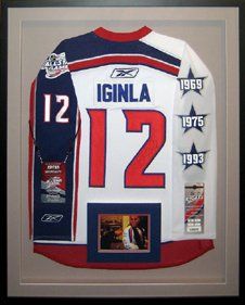 Signed Jarome Iginla All-Star game hockey jersey framed in a black shadow box with grey mats