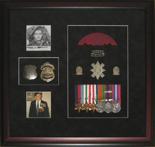 Shadow box with father's military and police memorabilia Photos, medals, police badges, regiment pins & badges framed in a mahogany shadow box with black suede mats
