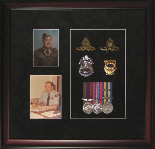 Shadow box with uncle's military and police memorabilia Photos, medals, military cap badges and police badges framed in a mahogany shadow box with black suede mats