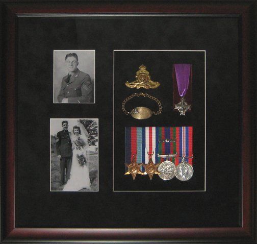 Shadow box with uncle's WWII military memorabilia Photos, medals, cap badge, ID bracelet, widow's Memorial Cross framed in a mahogany shadow box with black suede mats