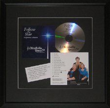 Chordially Yours Christmas CD, CD cover, song lyrics framed in a black shadow box with black mats