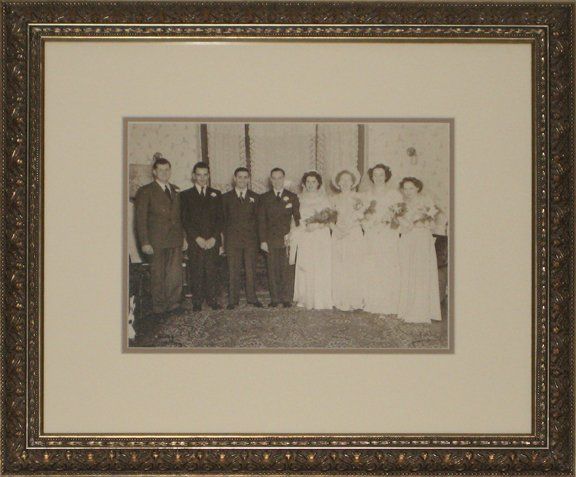 Antique style frame displaying a sepia tone wedding photo