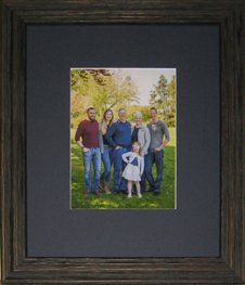 3 generation family photo taken in a park framed in a blue rustic frame with blue fabric mat
