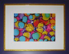 'Bright Blue' print by Hannah Hicks Art Hannah Hick's print of vibrant coloured shapes framed in a bright purple and yellow frame and white mat