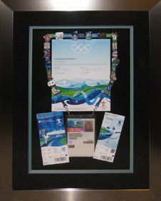2010 Vancouver Winter Olympics memorabilia shadow box ID card, certificate, event tickets & pins from the 2010 Vancouver Olympics framed in a silver shadow box with black, blue, green mats