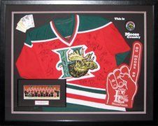 Team autographed Halifax Mooseheads hockey jersey and memorabilia framed in a black shadow box with black, red and green mats