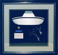 Nurse's memorabilia shadow box Nurse cap, pin, nametag, license, and  suture scissors framed in a black shadow box with grey speckled and black mats