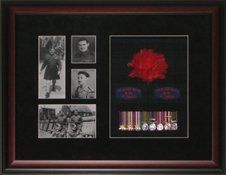 Photos, medal rack, hackle, Black Watch (RHR) patches framed in a mahogany shadow box with black suede mats and Black Watch tartan