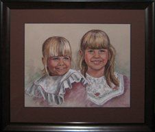 Two Young Sisters Pastel Portrait Pastel portrait of two young sisters framed in a dark brown frame with medium brown and dark brown mats