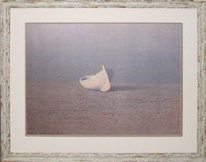Print of a cream coloured dory on a rocky beach framed in a cream rustic frame with cream and taupe mats