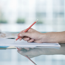 Photo of hand holding a pencil