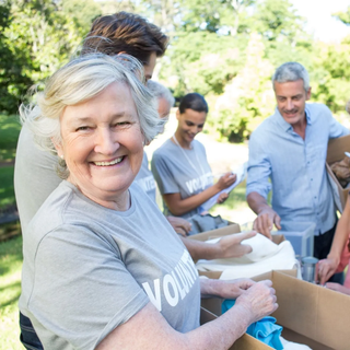 Photo of women with running numbers cheering