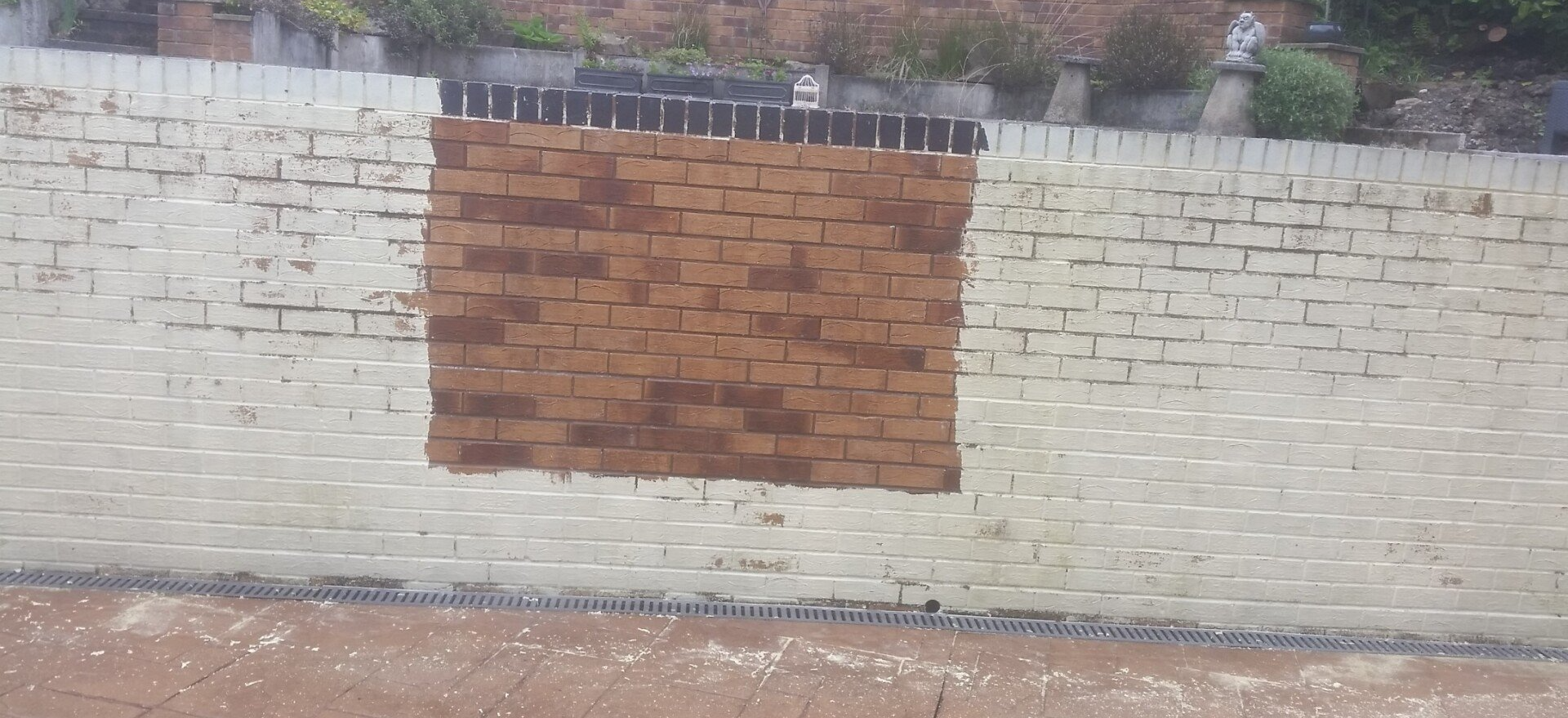 Painted brick wall showing effects of paint removal
