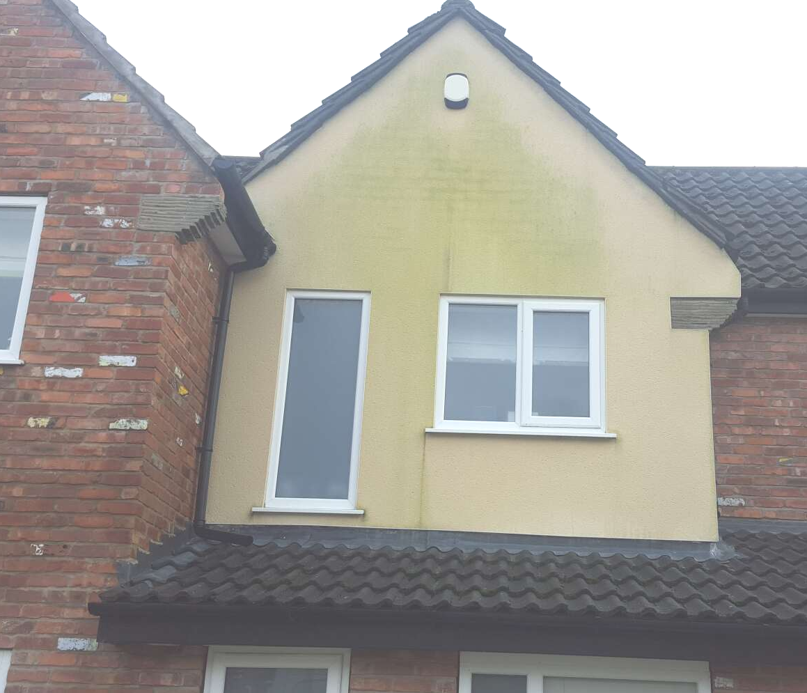 Rendered gable end before cleaning