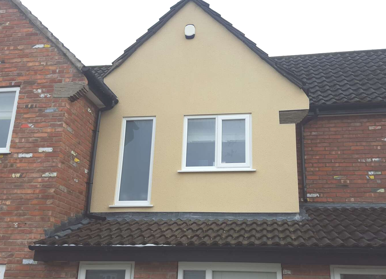 Rendered gable end after cleaning
