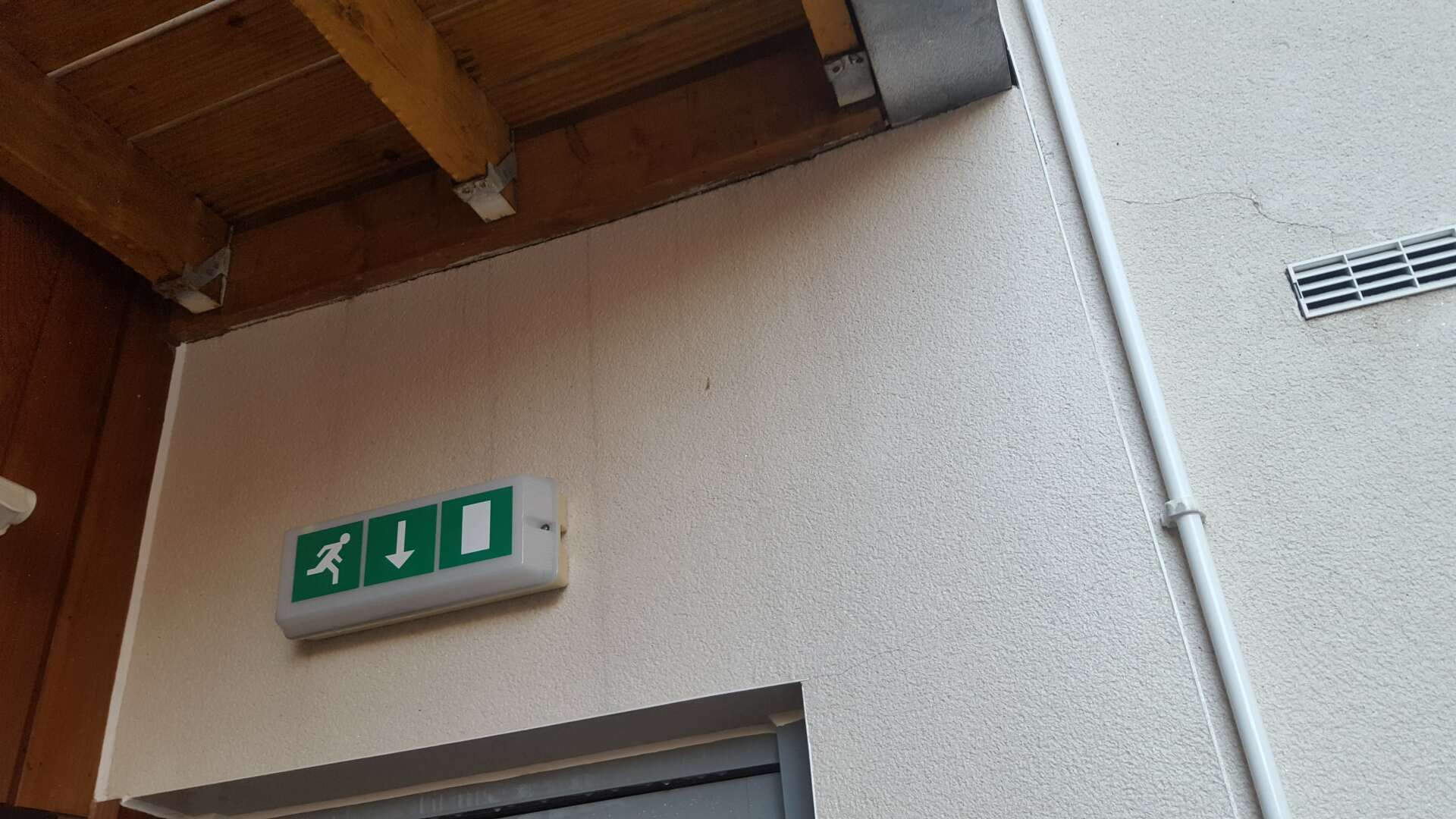 Stained render wall after cleaning