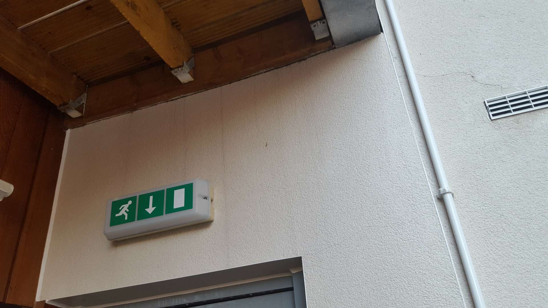 Stained render wall after cleaning