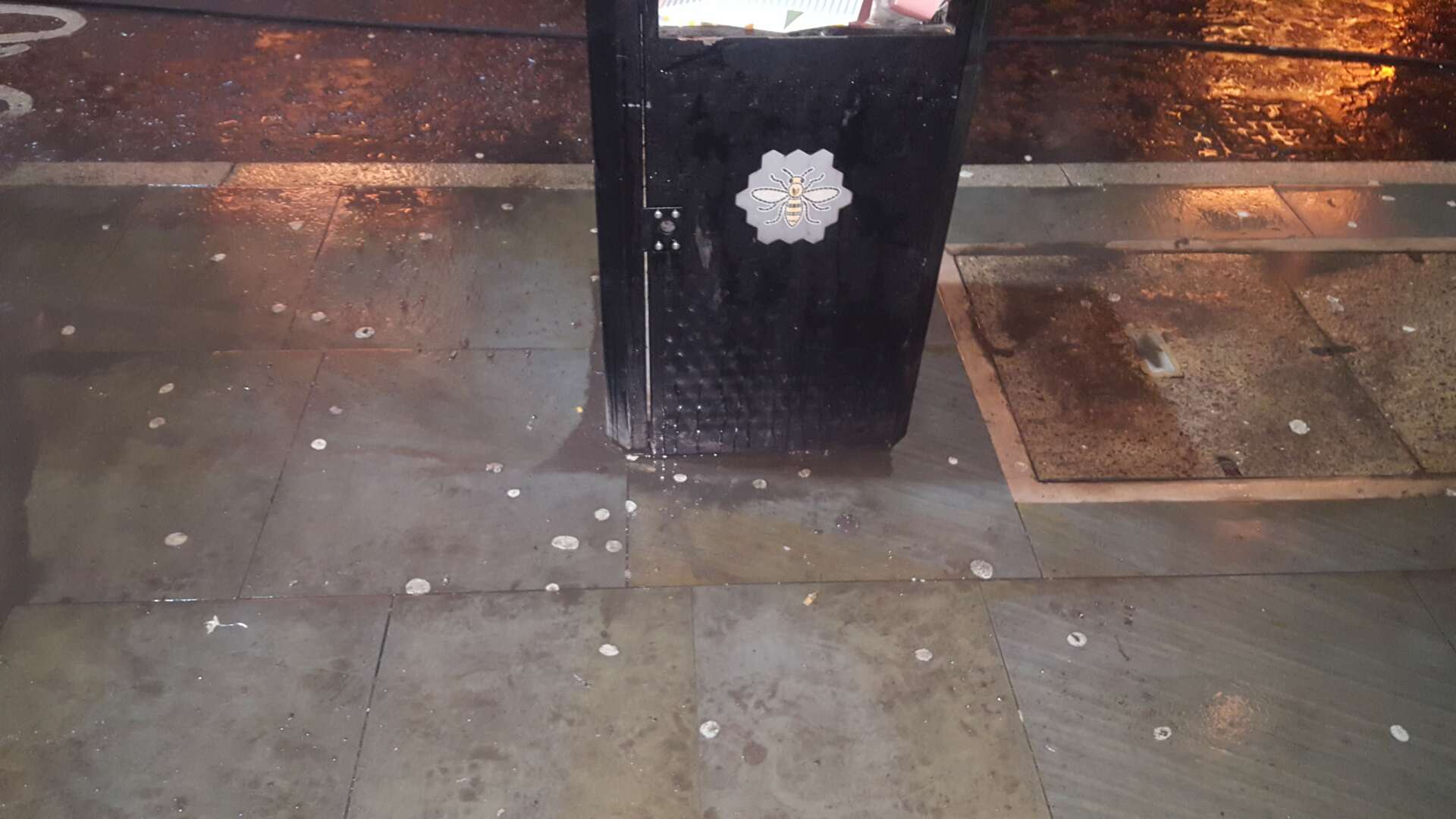 Pavement stained with chewing gum deposits before cleaning