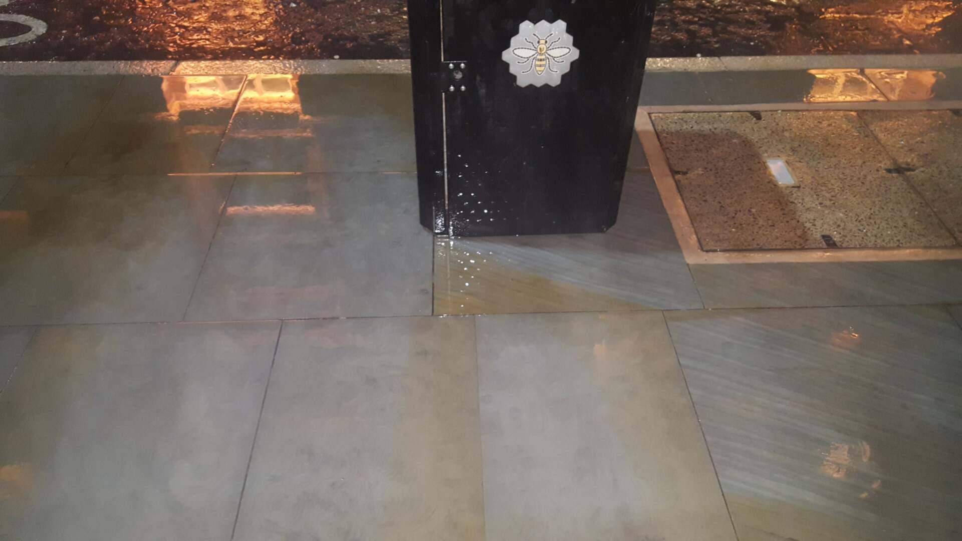 Pavement stained with chewing gum deposits after cleaning