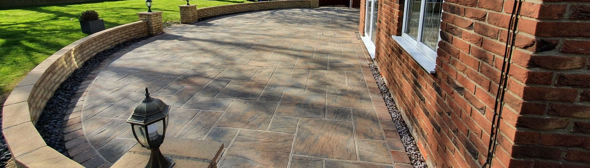 Pattern imprinted flagstone driveway after soft wash cleaning