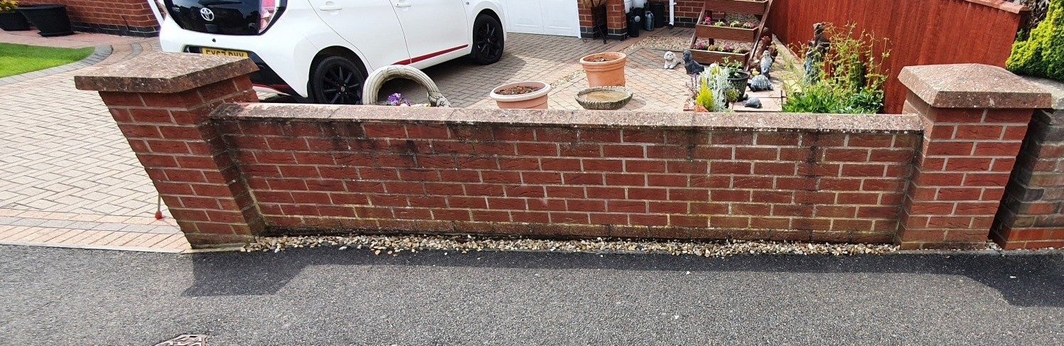 Brick wall before steam cleaning