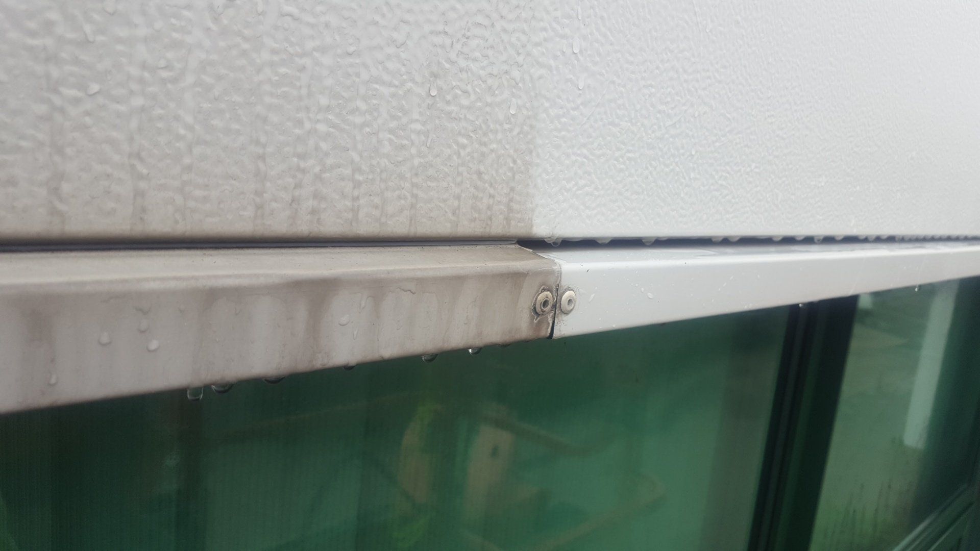 Dirty cladding showing effects of professional cleaning