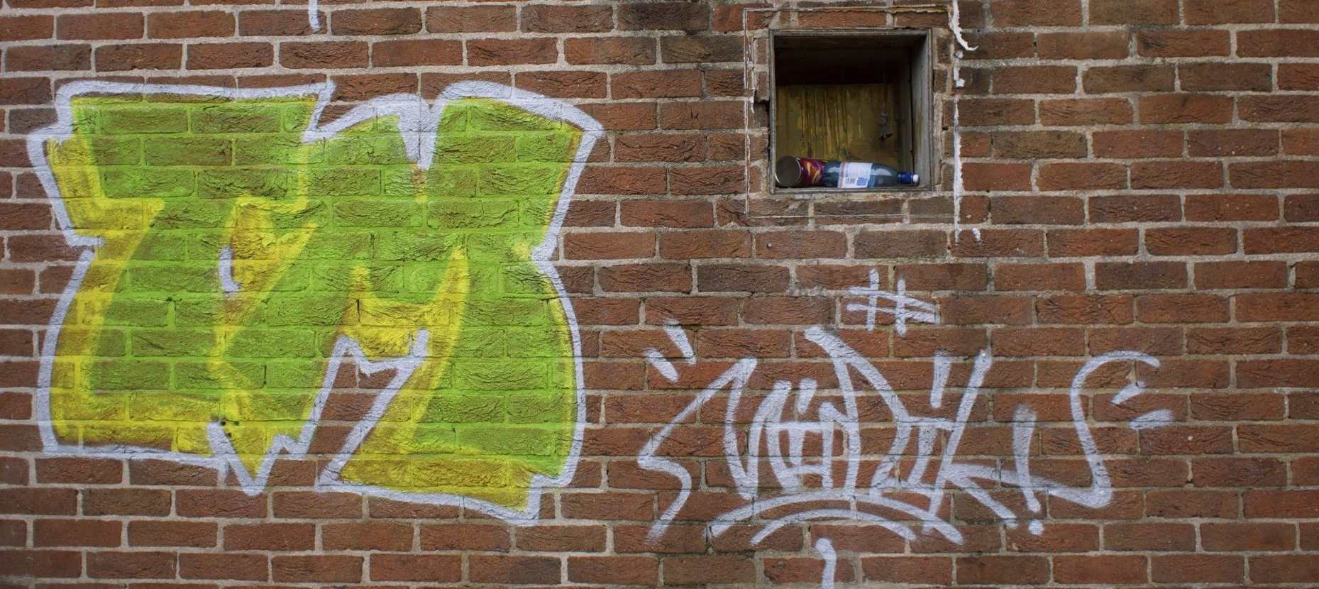 Graffiti on brick wall