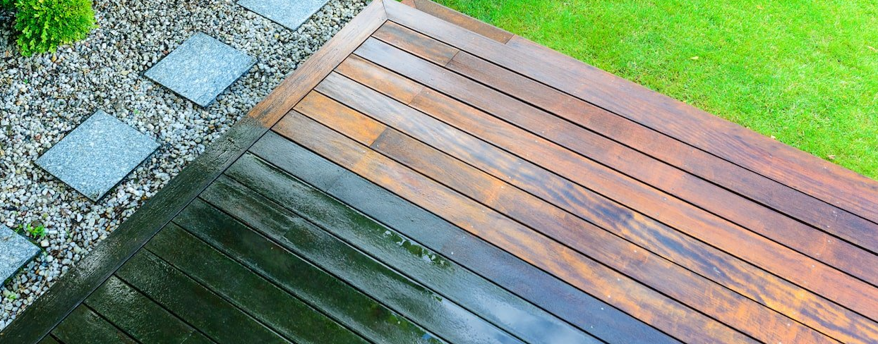 Timber decking showing before and after cleaning