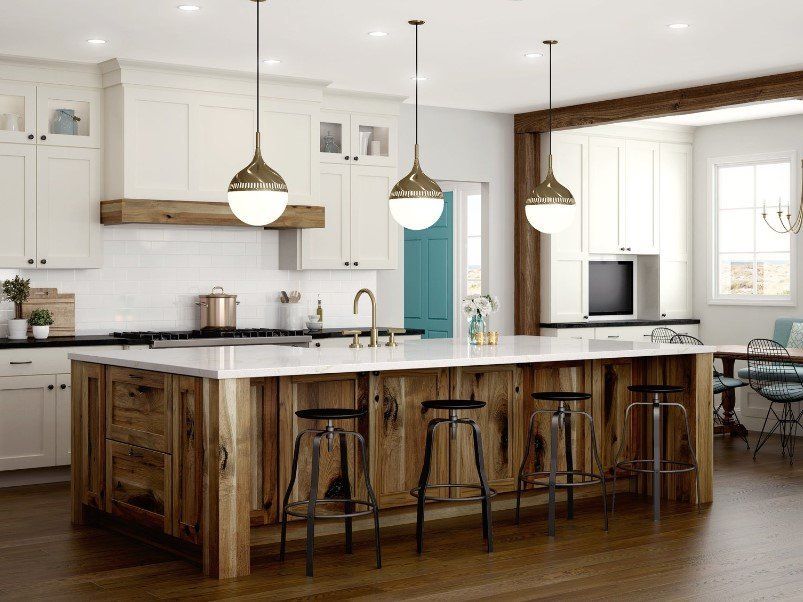 Woodland Cabinetry kitchen with white and rustic wood cabinets.