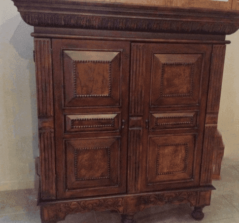 Carved wood cabinet as example of unique furniture.