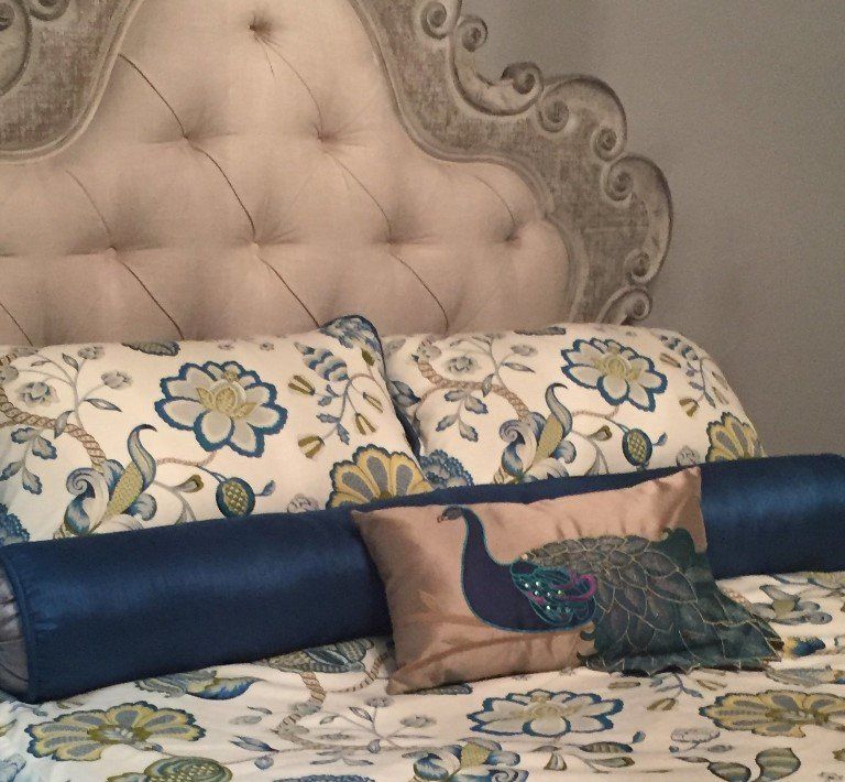 Example of bedding with colorful throw pillows.