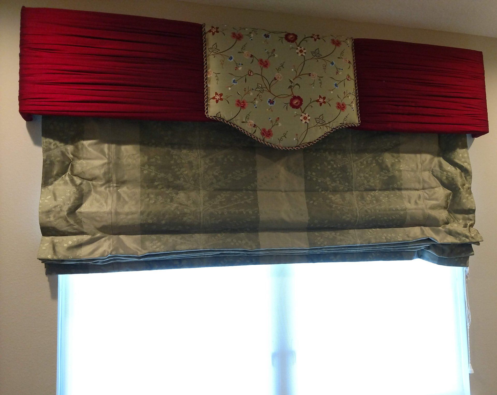 Custom silk cornice board and shade in red, spring green and other colors in floral embroidery.