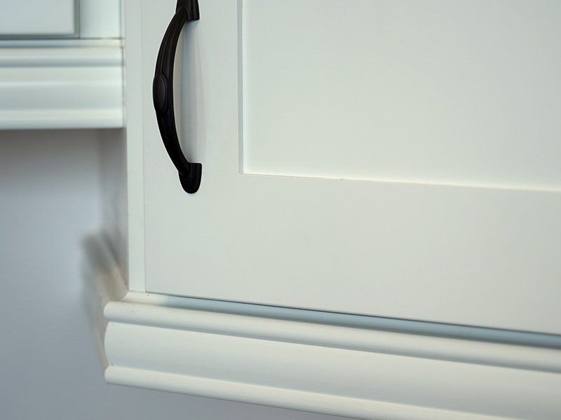 Ideal cabinetry base cabinet moulding example in ivory.
