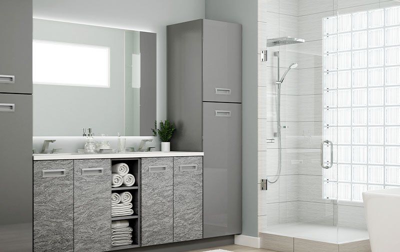 Ideal Cabinetry clean and contemporary bathroom with flat panel cabinets in gray and marbled tones.