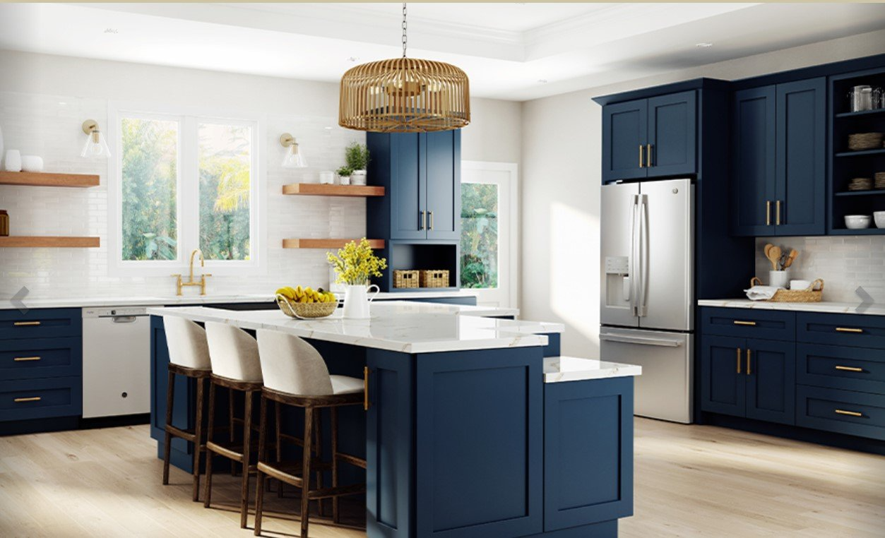 Kitchen with large island in Ideal cabinetry Nassau Blue cabinets.